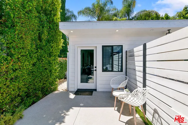 a view of house with outdoor seating space