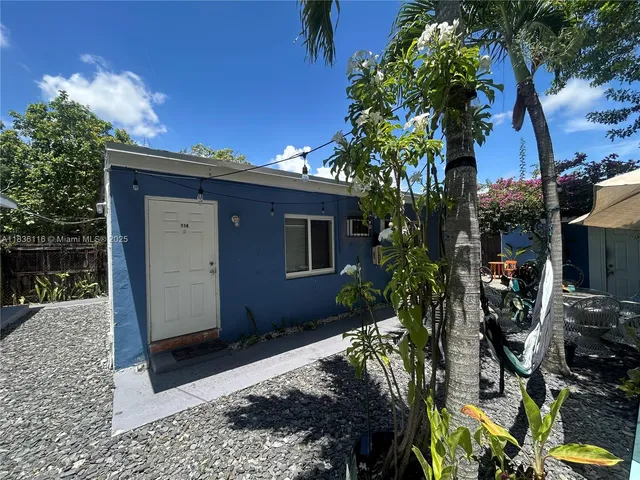 a house view with a backyard