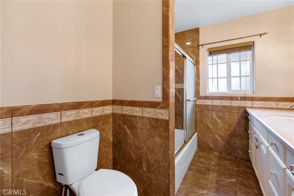 6249 Delfino Street Tujunga, CA 91042 - Photo 31 of 40 a bathroom with a toilet and a sink