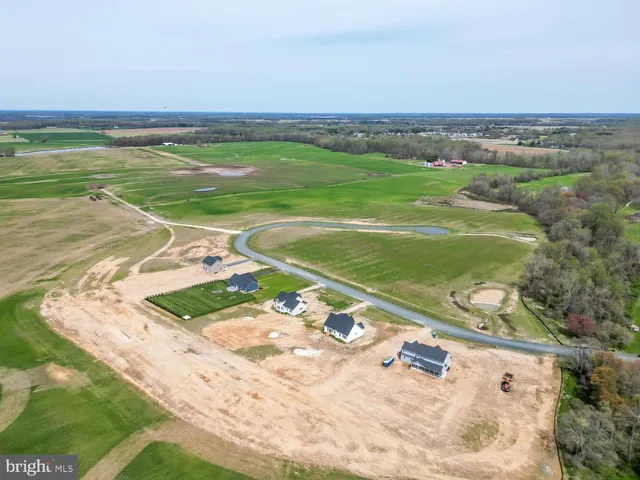 a view of a field with an ocean
