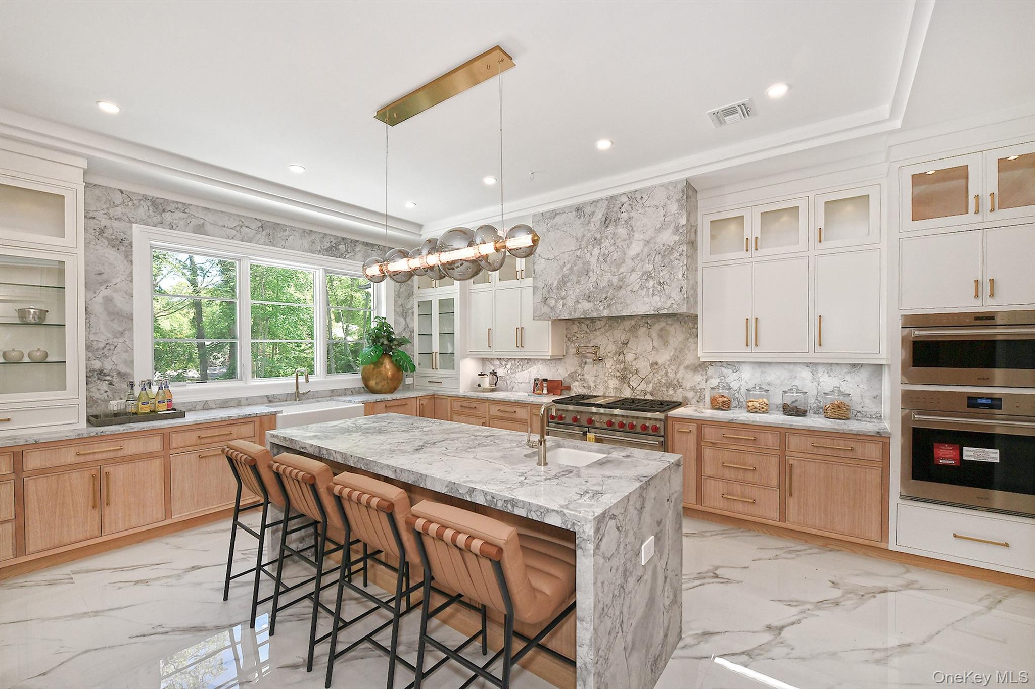 20 Knollwood Road Glen Head, NY 11545 - Photo 19 of 50 a kitchen with stainless steel appliances granite countertop stove top oven and cabinets