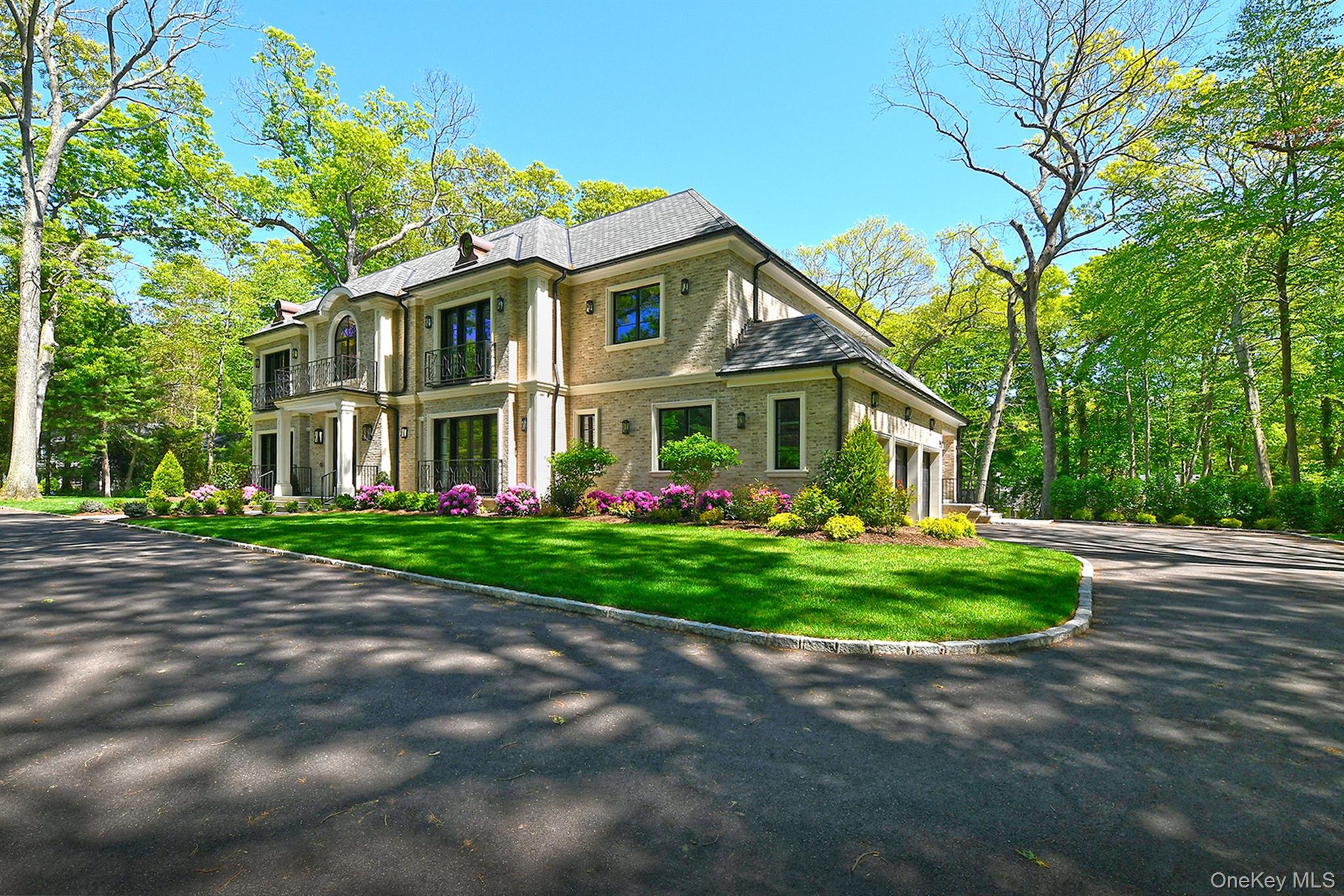 20 Knollwood Road Glen Head, NY 11545 - Photo 2 of 50 a front view of a house with a yard and trees
