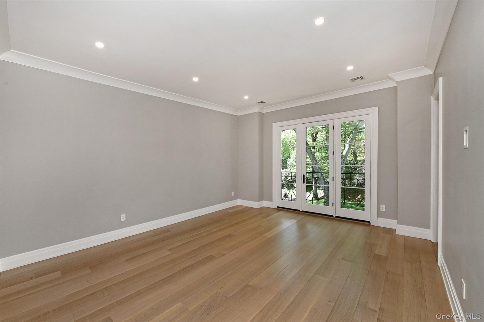 20 Knollwood Road Glen Head, NY 11545 - Photo 34 of 50 a view of an empty room with wooden floor and a window