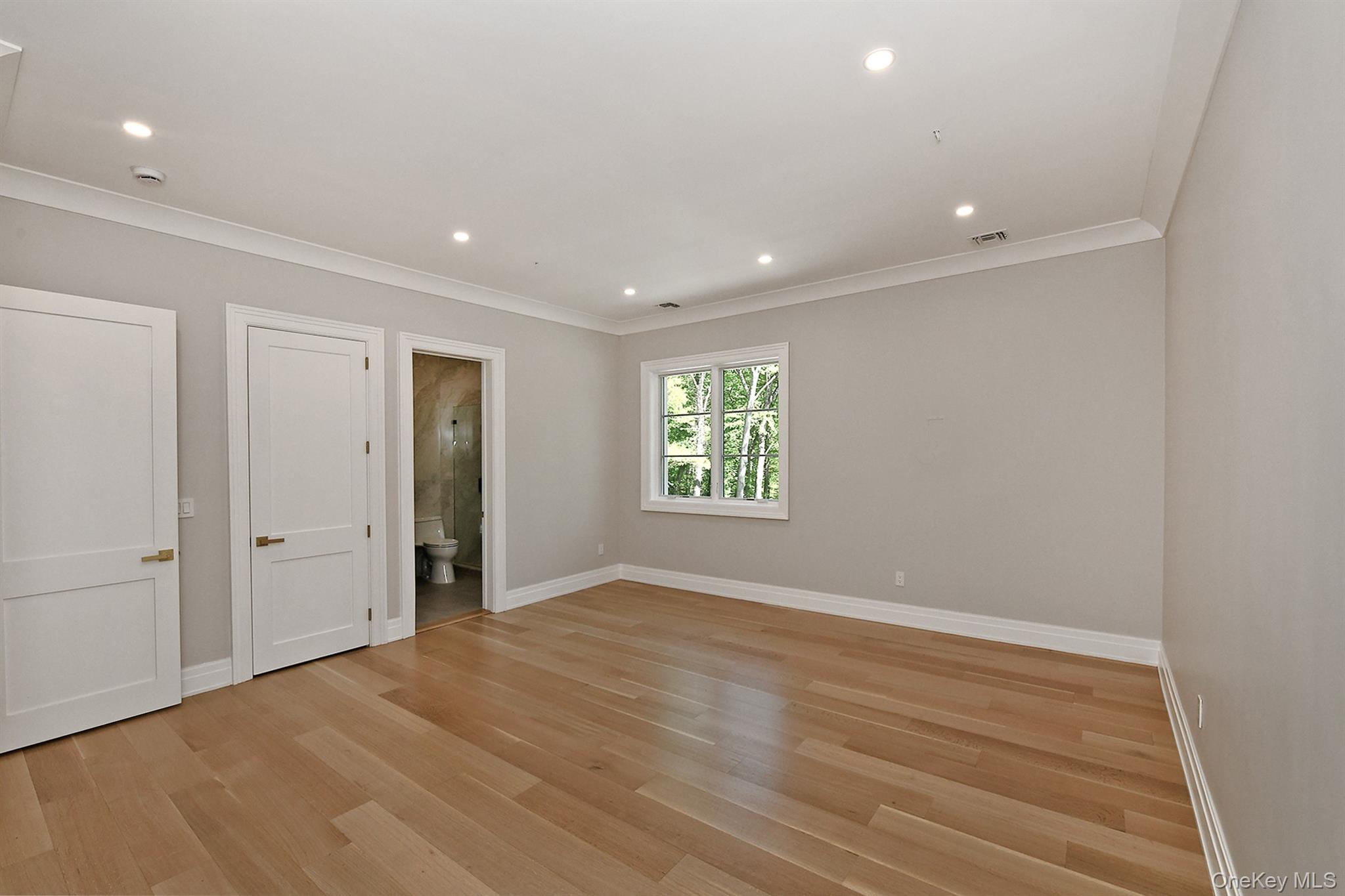 20 Knollwood Road Glen Head, NY 11545 - Photo 36 of 50 an empty room with wooden floor and windows