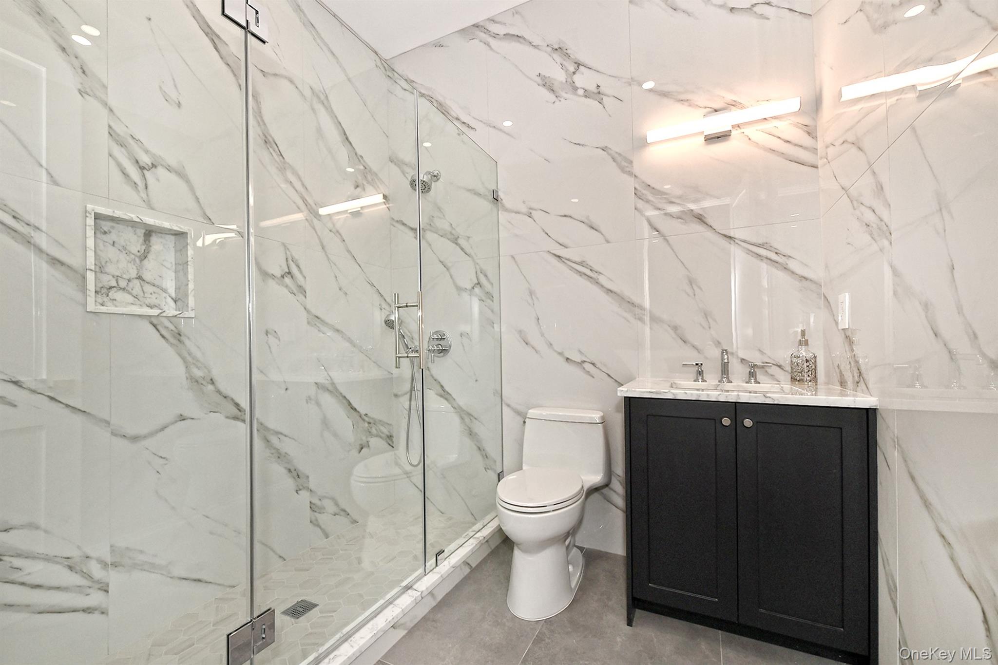 20 Knollwood Road Glen Head, NY 11545 - Photo 39 of 50 a bathroom with a sink toilet and shower