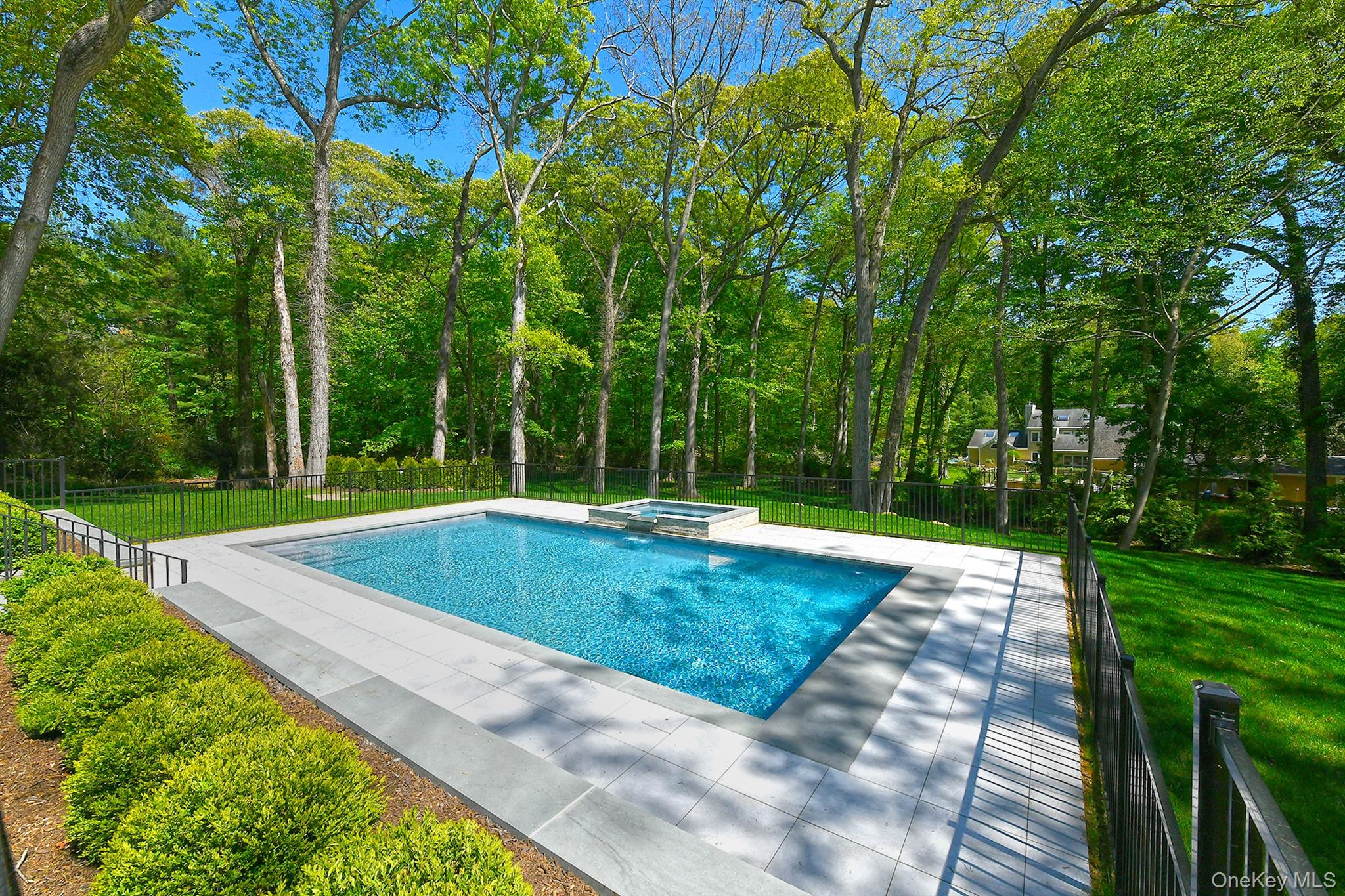 20 Knollwood Road Glen Head, NY 11545 - Photo 45 of 50 a view of a swimming pool with a yard