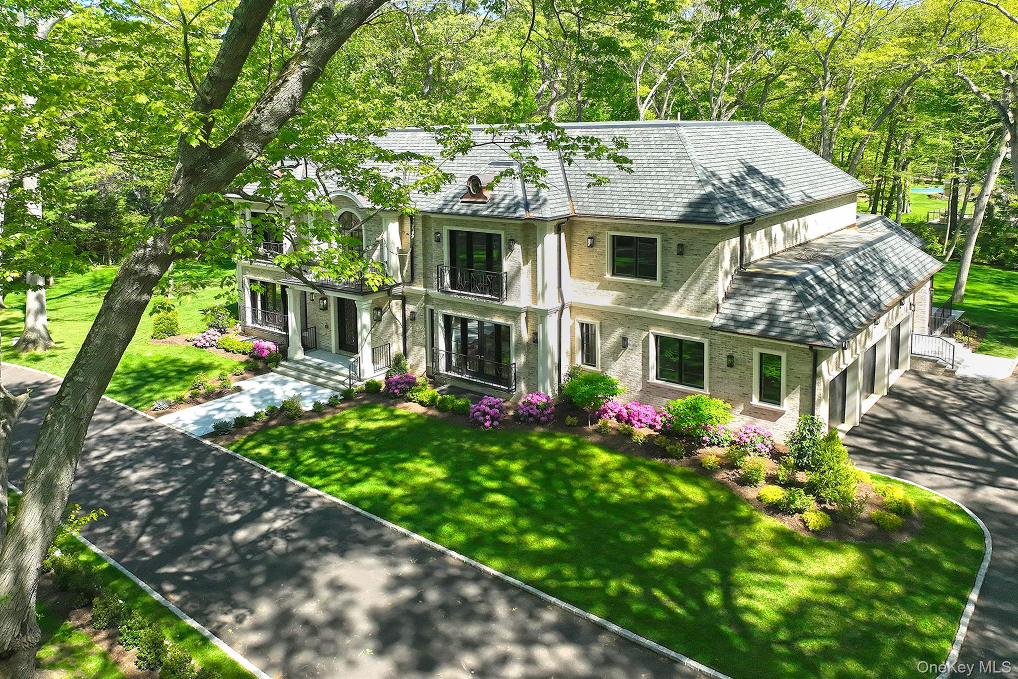 20 Knollwood Road Glen Head, NY 11545 - Photo 49 of 50 a aerial view of a house with a yard table and chairs