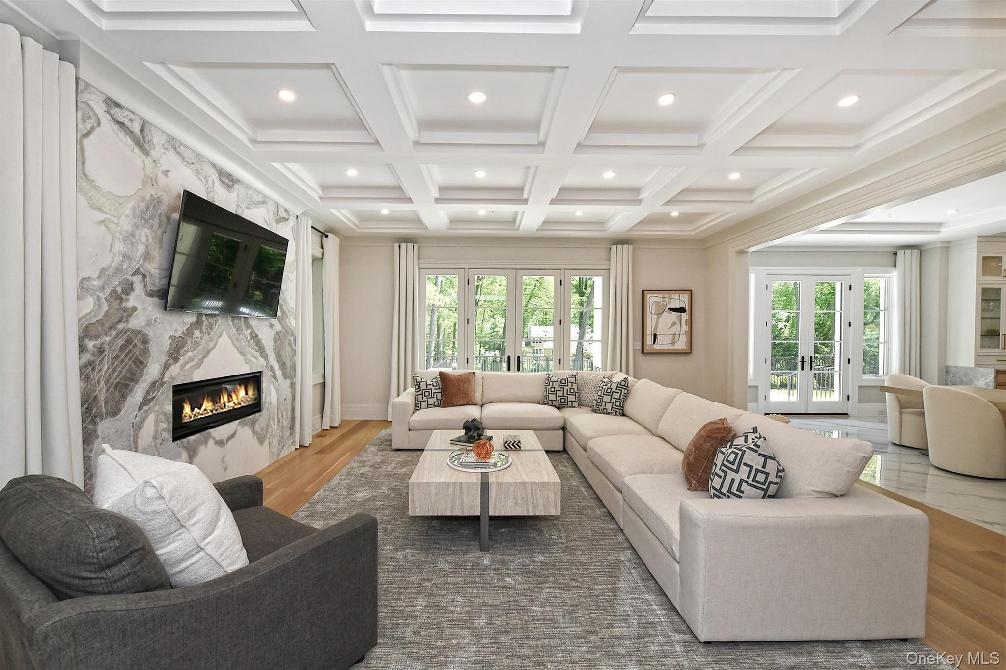20 Knollwood Road Glen Head, NY 11545 - Photo 10 of 50 a living room with furniture a fireplace and a flat screen tv