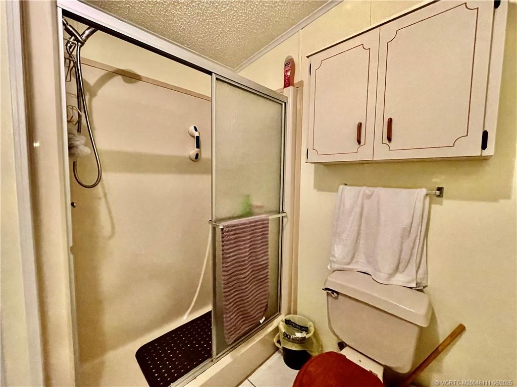 14524 Southwest Rake Drive Indiantown, FL 34956 - Photo 20 of 24 a bathroom with a sink and a mirror