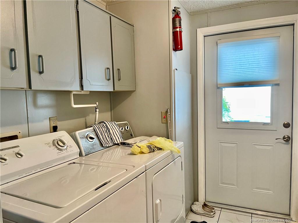 14524 Southwest Rake Drive Indiantown, FL 34956 - Photo 23 of 24 a utility room with dryer and washer