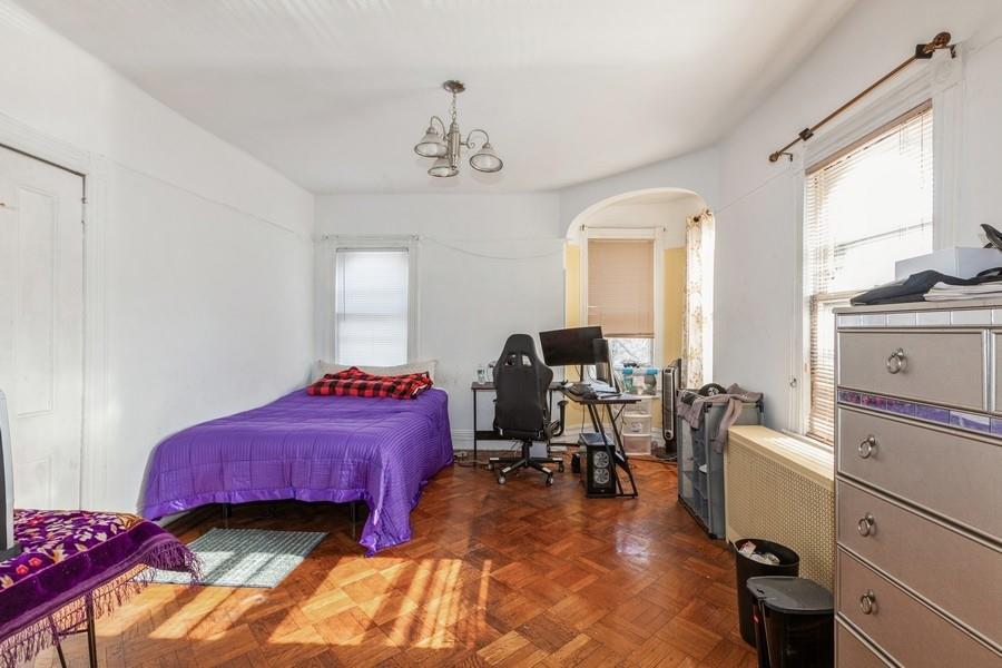 1205 Beverley Road Brooklyn, NY 11218 - Photo 12 of 34 a room with a bed and a view of living room