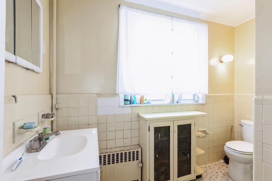 1205 Beverley Road Brooklyn, NY 11218 - Photo 21 of 34 a bathroom with a sink toilet and shower