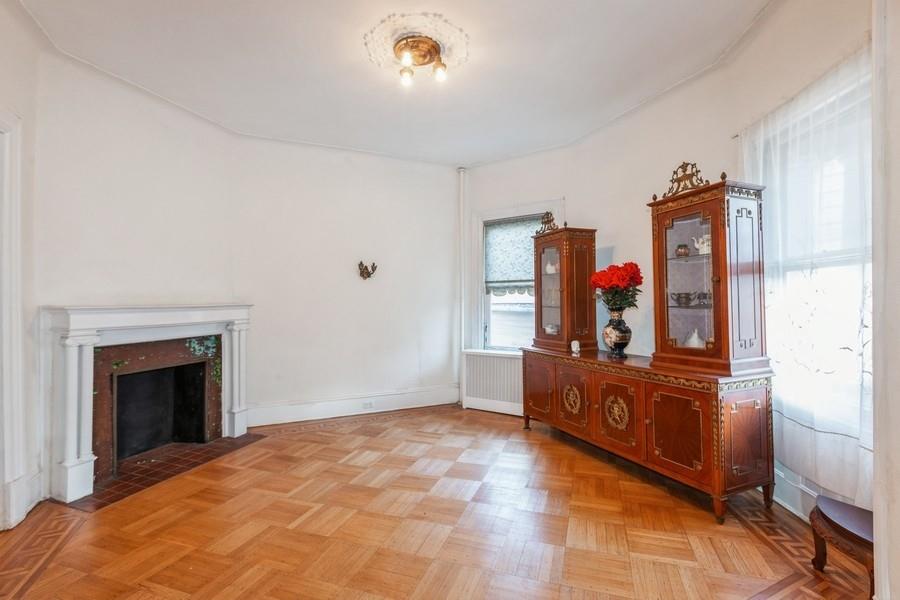 1205 Beverley Road Brooklyn, NY 11218 - Photo 7 of 34 a living room with furniture and a fireplace