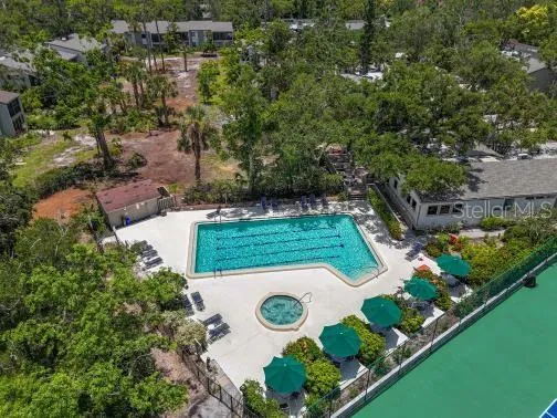 an aerial view of a house with yard