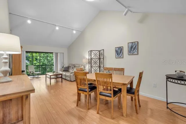 a view of a dining room with furniture window and outside view