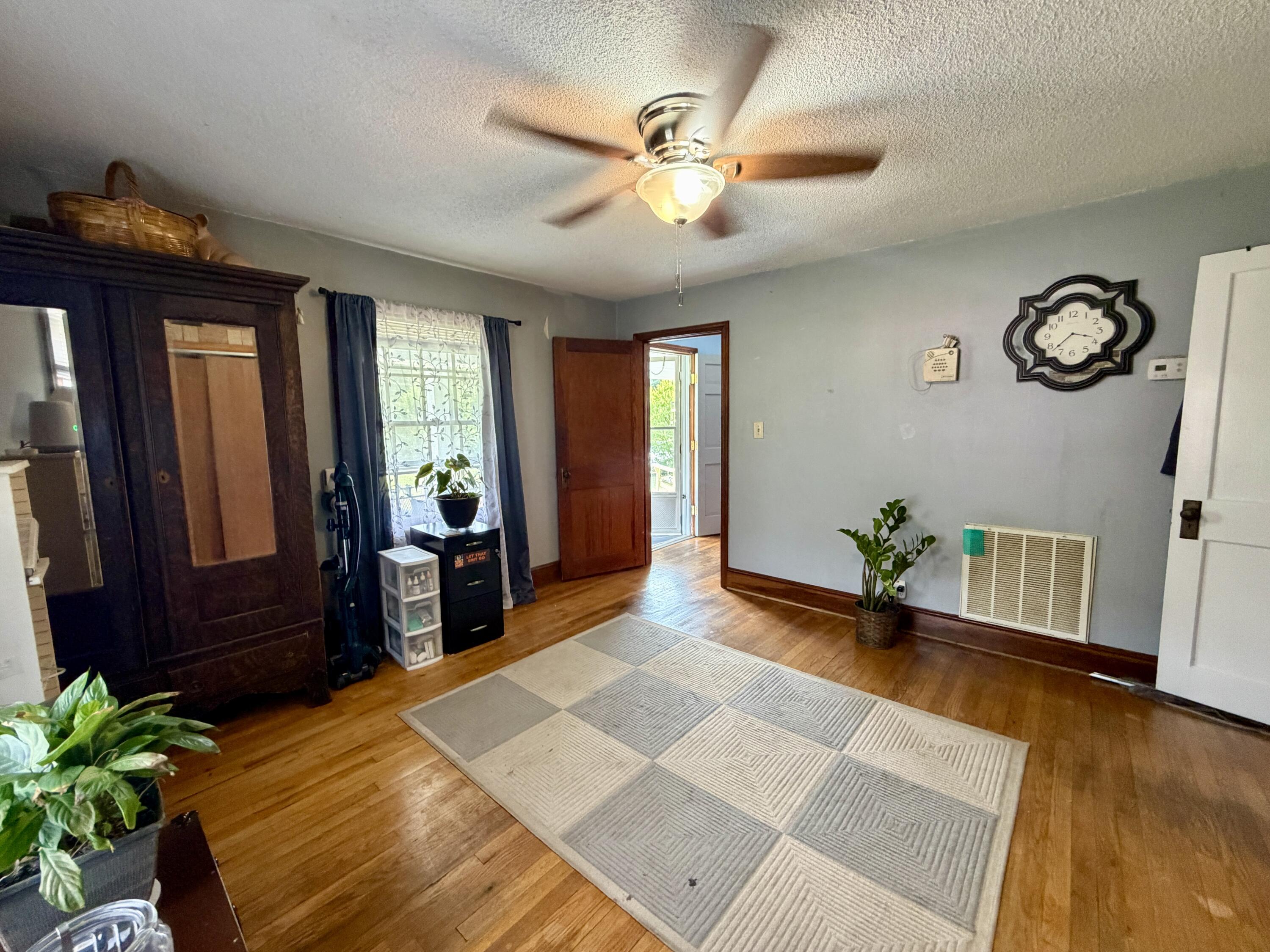 1491 Jones Ridge Road Axton, VA 24054 - Photo 5 of 17 a bedroom with a bed and a chandelier