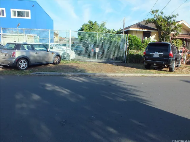 a view of street with parked cars