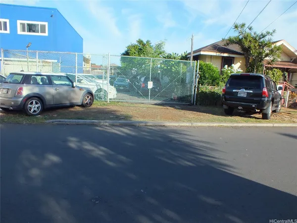a view of a car parked on the side of the road