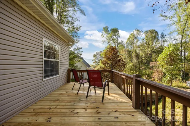 a view of a balcony with furniture