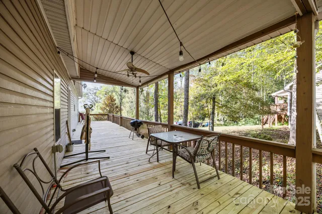 a view of a patio with chairs and wooden floor
