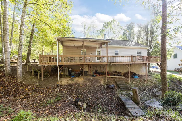 a view of a house with backyard porch and sitting area