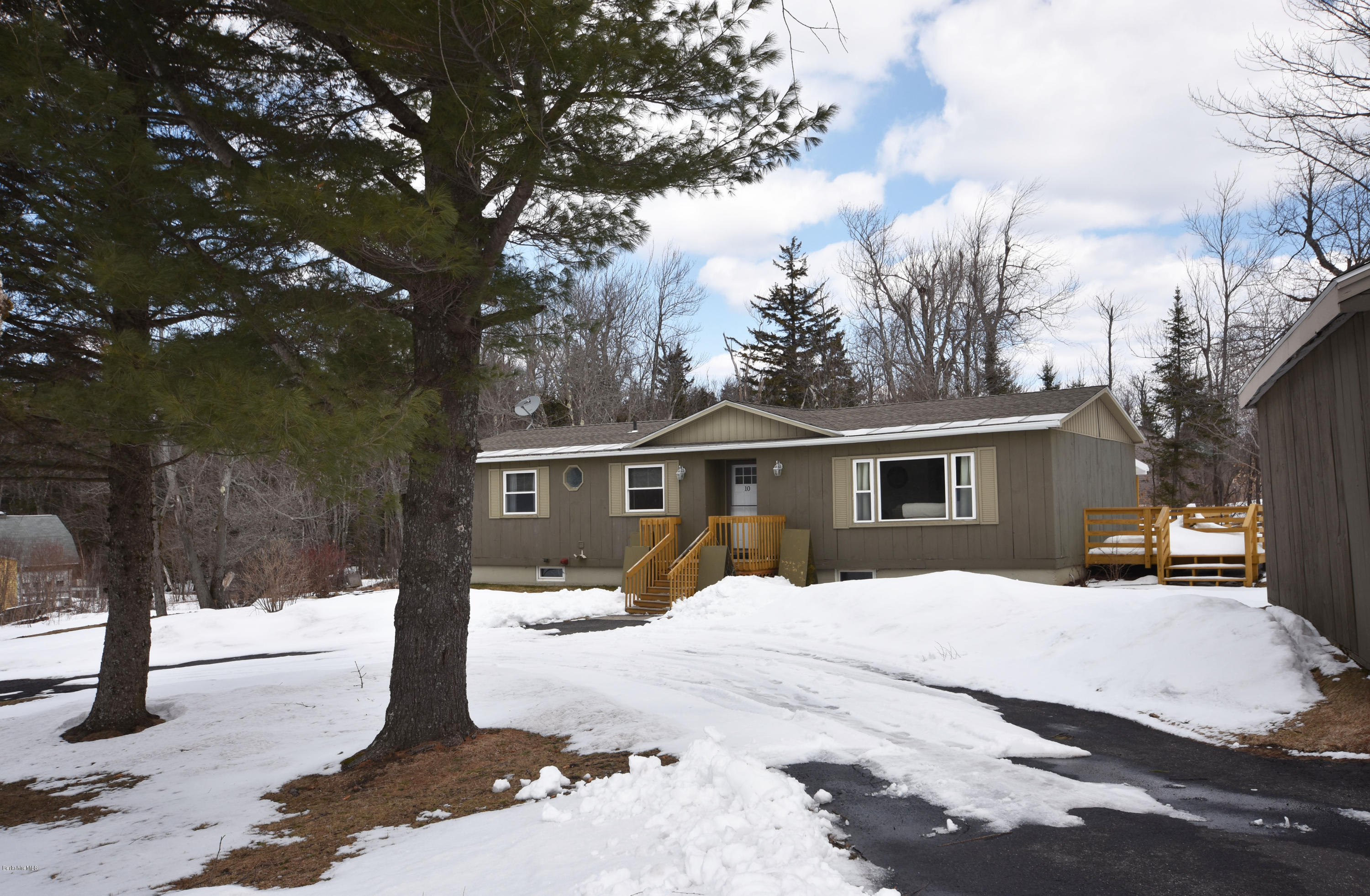 10 West Main Road Peru, MA 01235 - Photo 1 of 45 a view of a house with a yard covered in snow