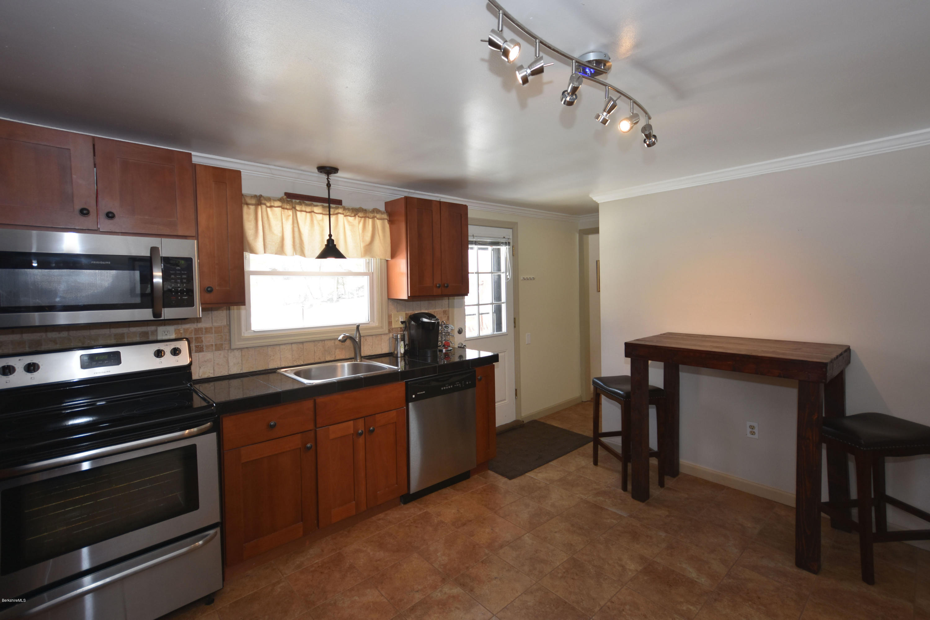 10 West Main Road Peru, MA 01235 - Photo 17 of 45 a kitchen with a stove a sink and a microwave