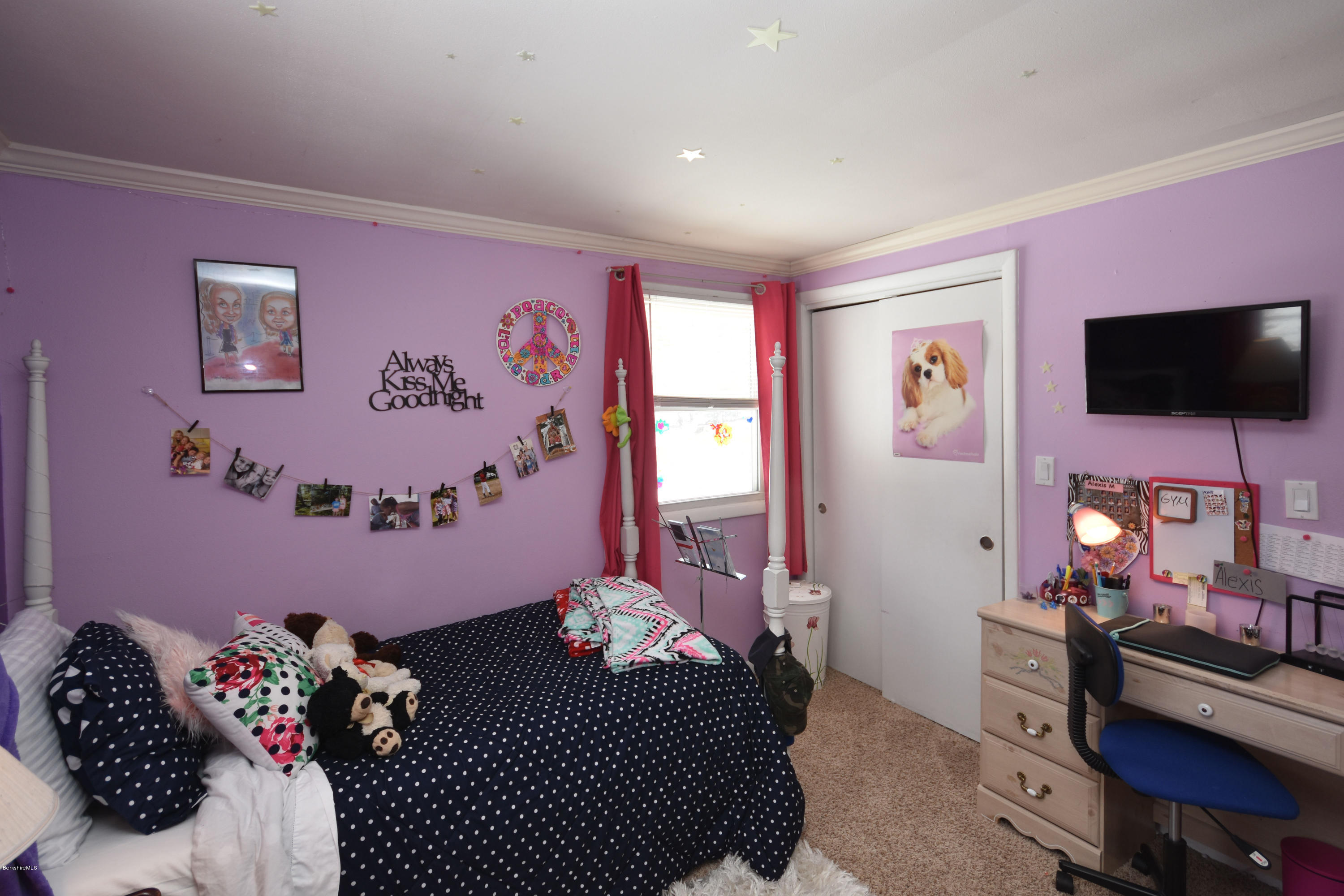 10 West Main Road Peru, MA 01235 - Photo 27 of 45 a bedroom with a bed and a flat screen tv