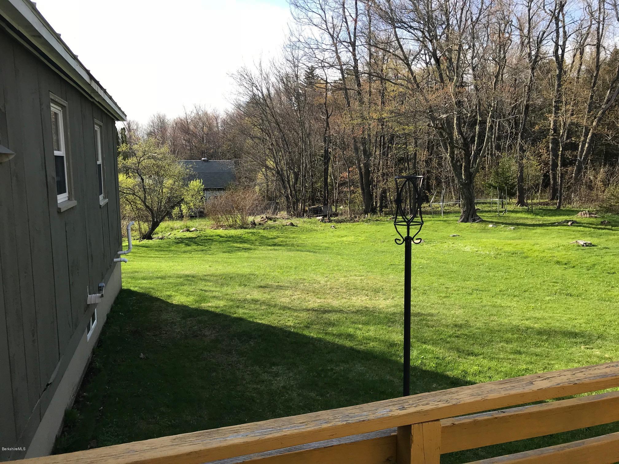 10 West Main Road Peru, MA 01235 - Photo 8 of 45 a view of a golf course with a garden