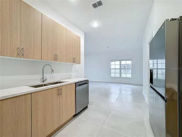 a view of an empty room with a window