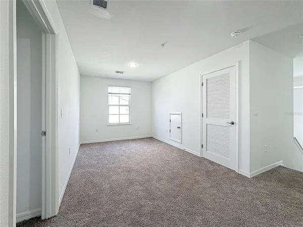 a white toilet sitting next to a bath tub and a shower
