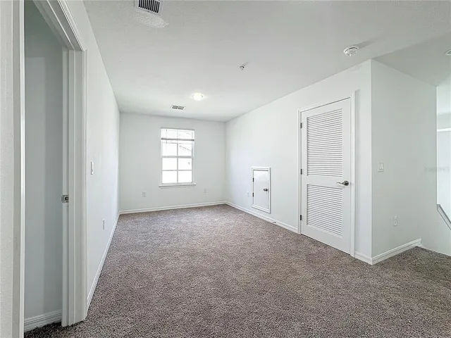 a white toilet sitting next to a bath tub and a shower