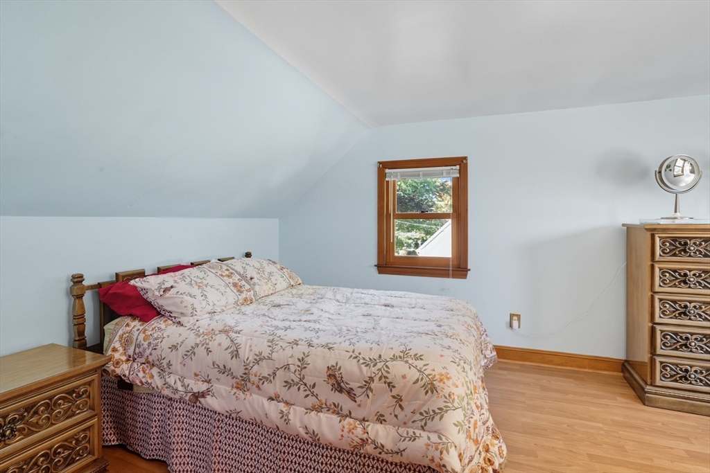 72 Collins Street Danvers, MA 01923 - Photo 11 of 24 a bedroom with a bed and wooden floor