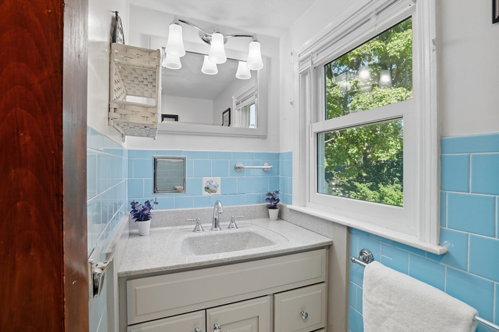 72 Collins Street Danvers, MA 01923 - Photo 14 of 24 a bathroom with a sink and a mirror