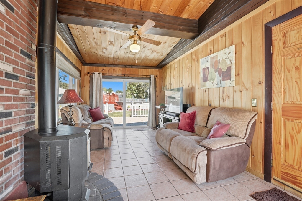 72 Collins Street Danvers, MA 01923 - Photo 16 of 24 a living room with furniture and a large window