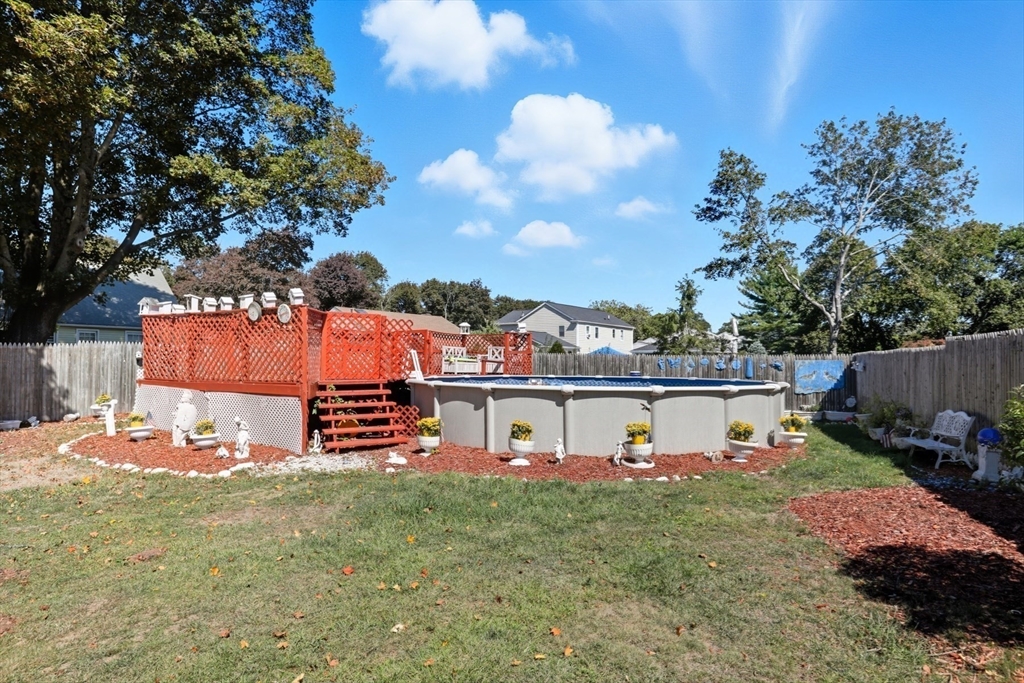 72 Collins Street Danvers, MA 01923 - Photo 20 of 24 an outdoor space with furniture and garden