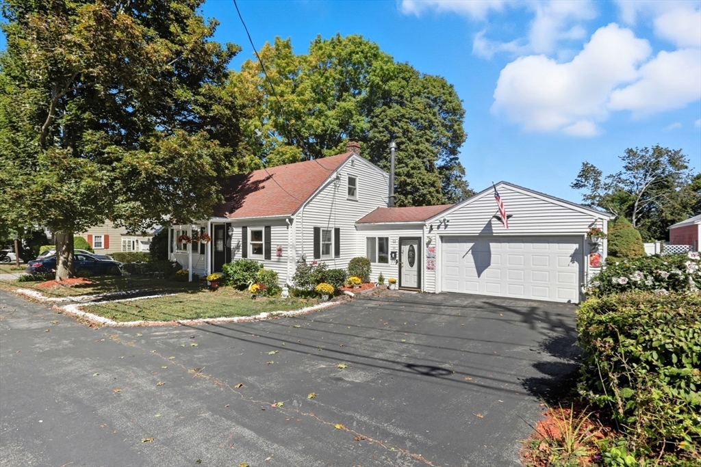 72 Collins Street Danvers, MA 01923 - Photo 22 of 24 a front view of a house with a garden