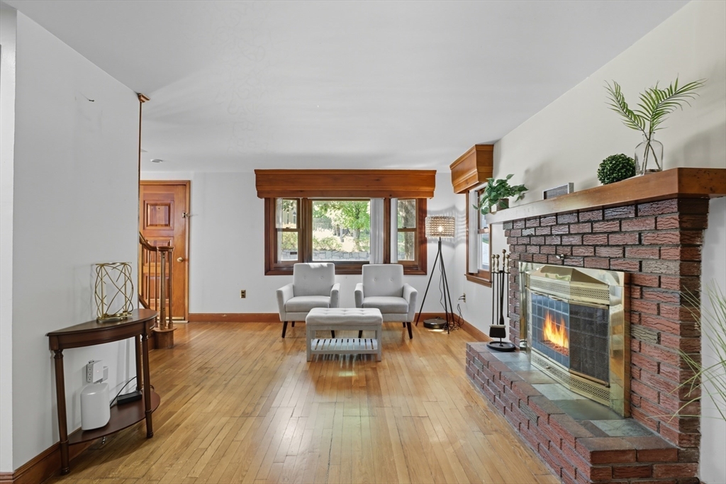 72 Collins Street Danvers, MA 01923 - Photo 6 of 24 a living room with furniture and a fireplace