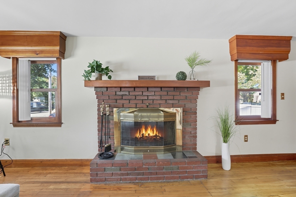72 Collins Street Danvers, MA 01923 - Photo 7 of 24 a living room with furniture and a fireplace