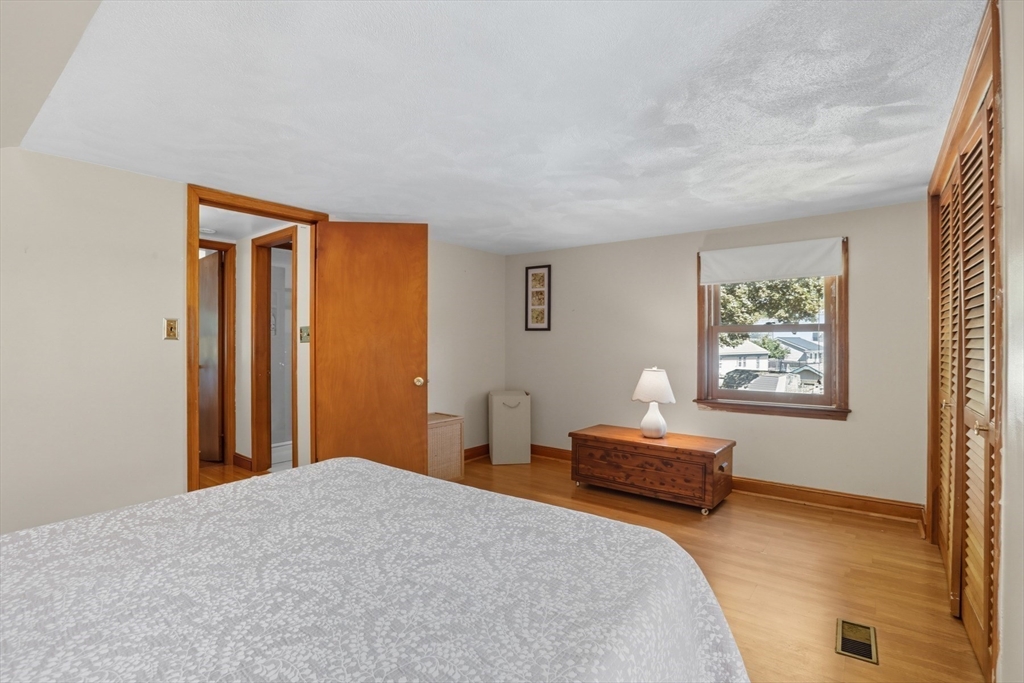 72 Collins Street Danvers, MA 01923 - Photo 10 of 24 a bedroom with a bed and a window