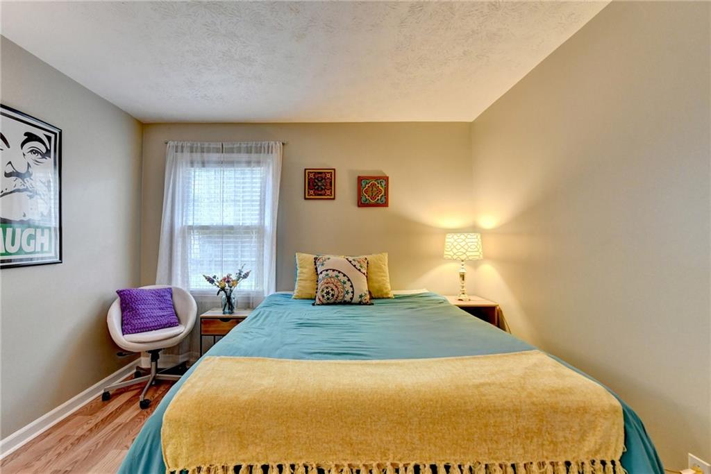 6700 Roswell Road, Unit 22B Atlanta, GA 30328 - Photo 18 of 34 a bedroom with a bed and window