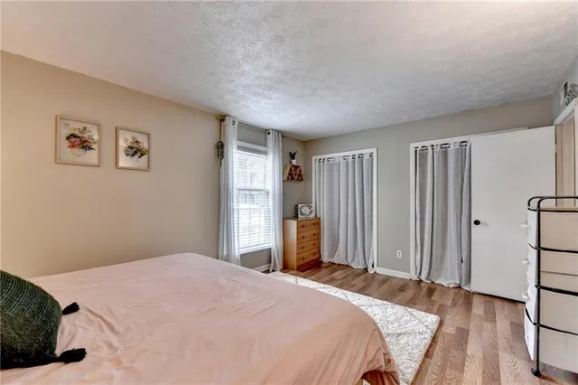 a bedroom with a bed and a closet