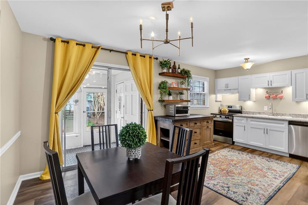 6700 Roswell Road, Unit 22B Atlanta, GA 30328 - Photo 7 of 34 a kitchen with a table and chairs in it