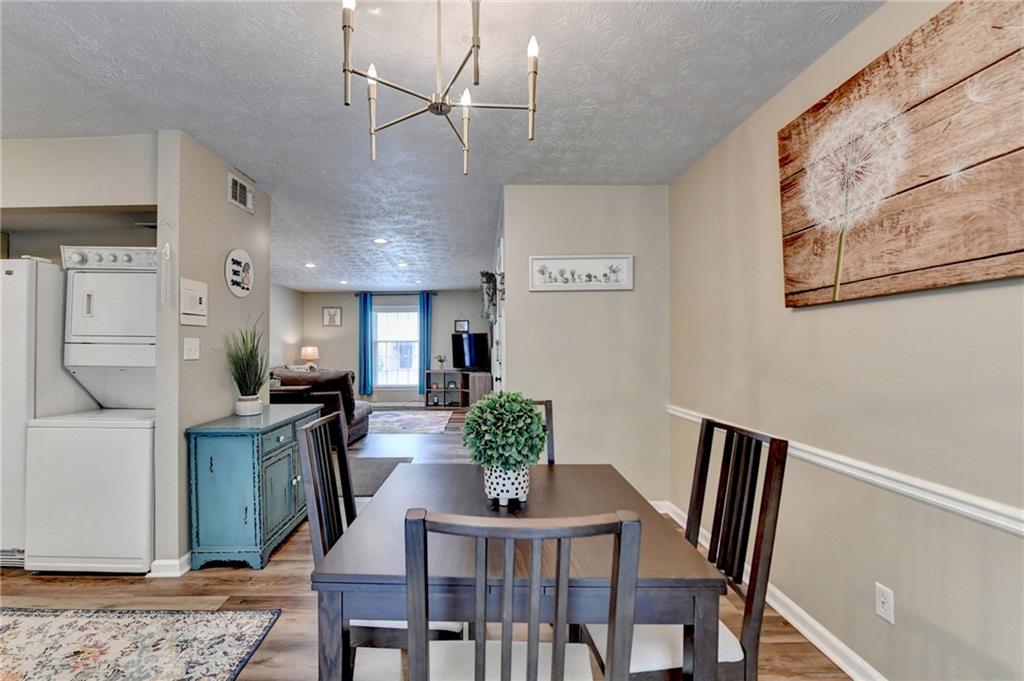 6700 Roswell Road, Unit 22B Atlanta, GA 30328 - Photo 10 of 34 a view of a dining room with furniture