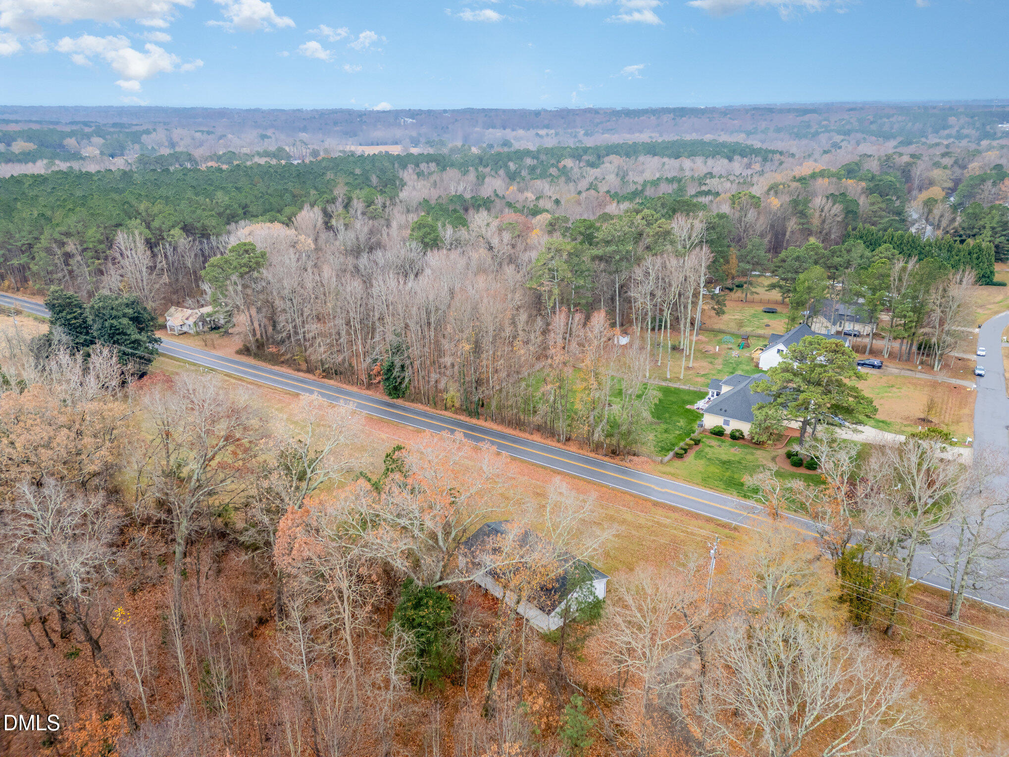 6801 Rock Service Station Road Raleigh, NC 27603 - Photo 12 of 36 a view of a yard with wooden fence