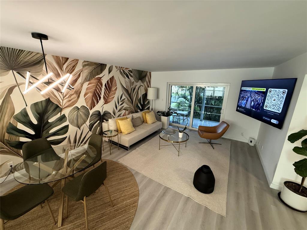 10 Southeast 13th Street, Unit B3 Boca Raton, FL 33432 - Photo 14 of 85 a view of a livingroom with furniture and floor to ceiling window