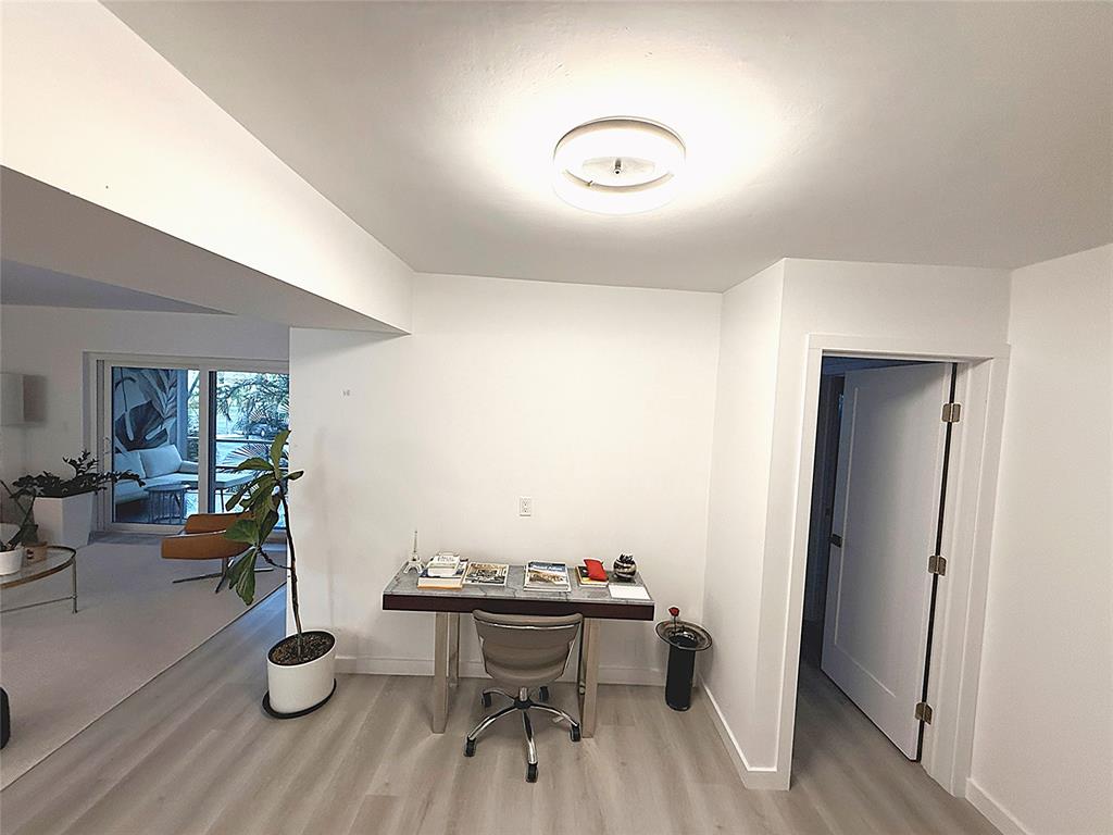 10 Southeast 13th Street, Unit B3 Boca Raton, FL 33432 - Photo 18 of 85 a view of a livingroom with furniture and hardwood floor