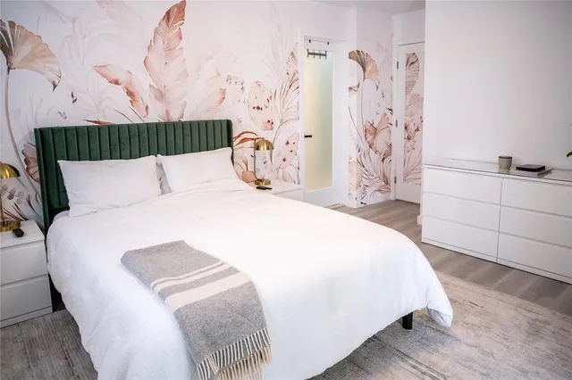 a bathroom with a shower and a glass door