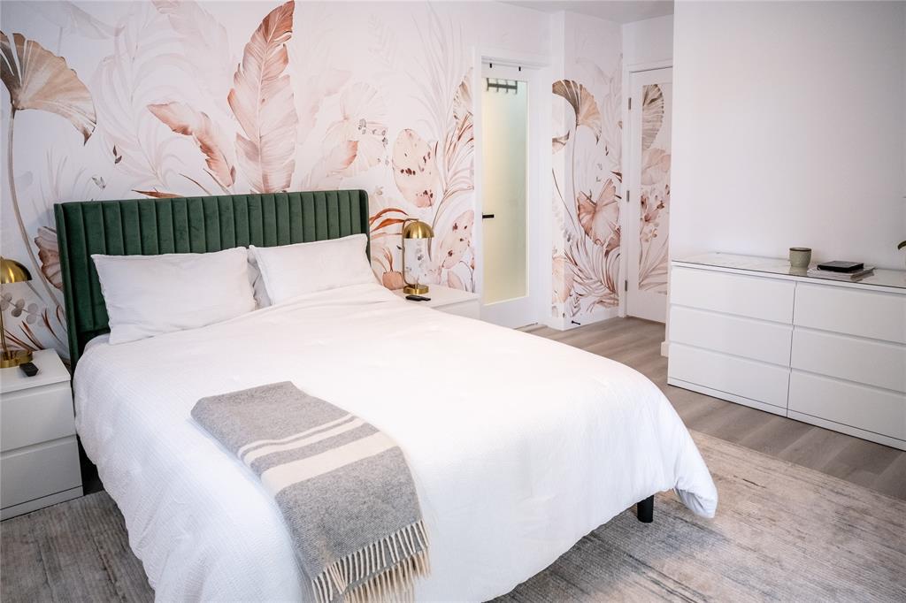 10 Southeast 13th Street, Unit B3 Boca Raton, FL 33432 - Photo 22 of 85 a spacious bedroom with a bed and a dresser