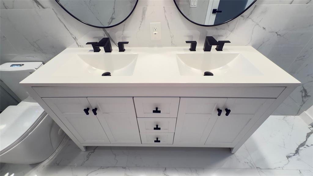 10 Southeast 13th Street, Unit B3 Boca Raton, FL 33432 - Photo 27 of 85 a bathroom with a sink and a mirror